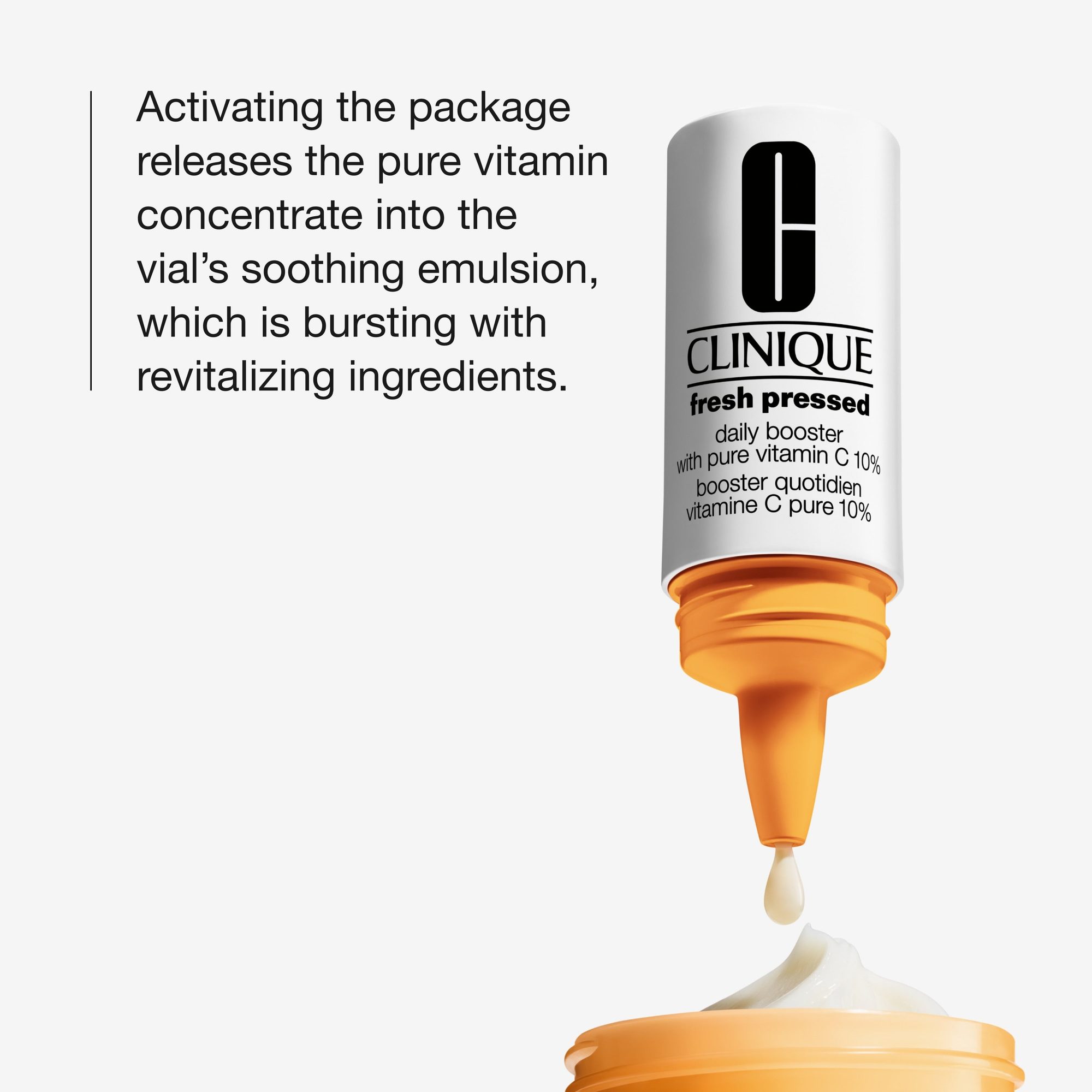 White bottle with orange dispenser showing a drop of pale yellow serum falling onto white cream below